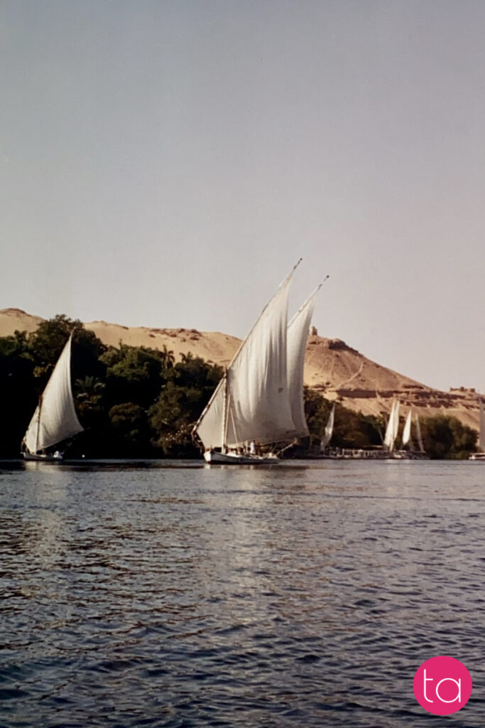 Traditional wooden sailing boat called felucca on the Nile River in Aswan, Egypt