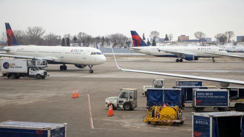 white passenger plane on airport