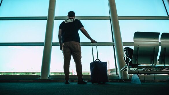 man holding luggage bag