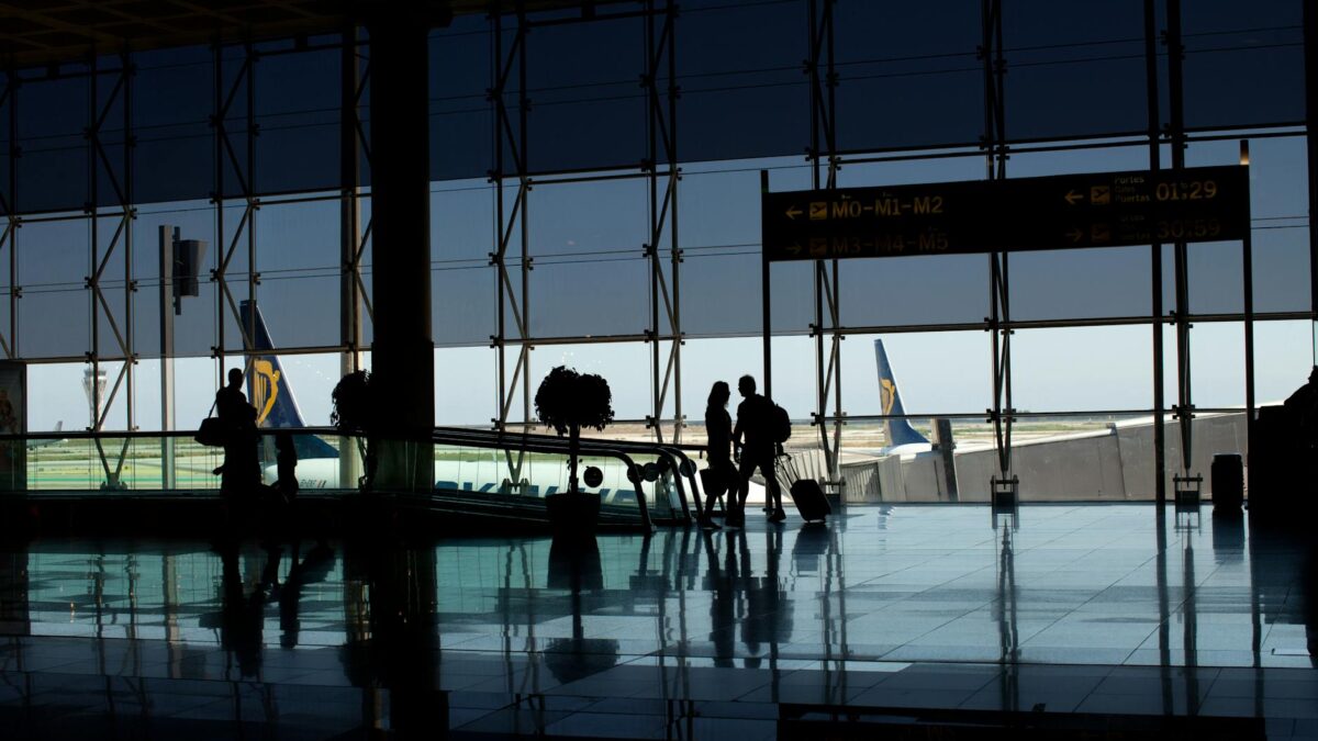 silhouette of people walking at the airport