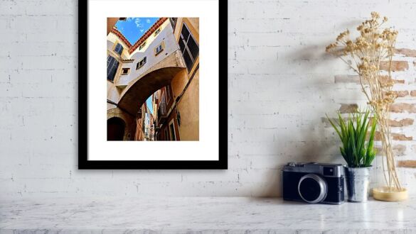 Arched Alleyway in Palma de Mallorca's Historic Old Town Framed Print