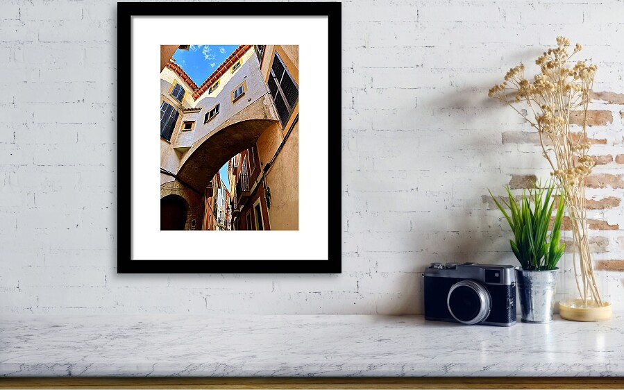 Arched Alleyway in Palma de Mallorca's Historic Old Town Framed Print