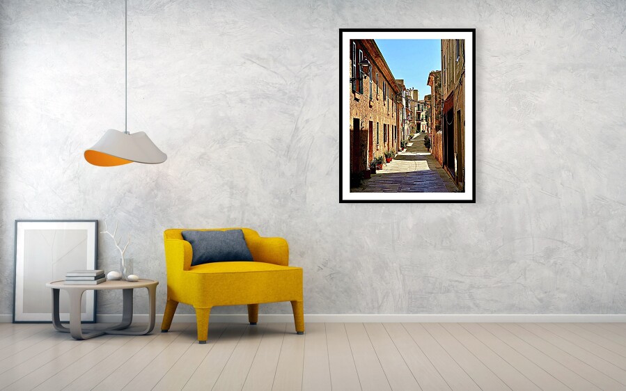 Sunlit Stone Alley in Alcudia Old Town, Majorca Framed Print