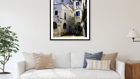 Whitewashed Street with Blue Shutters in Sitges, Spain Framed Print