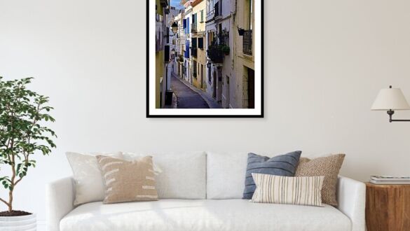 Long White-Walled Alley with Blue Shutters, Sitges Old Town Framed Print