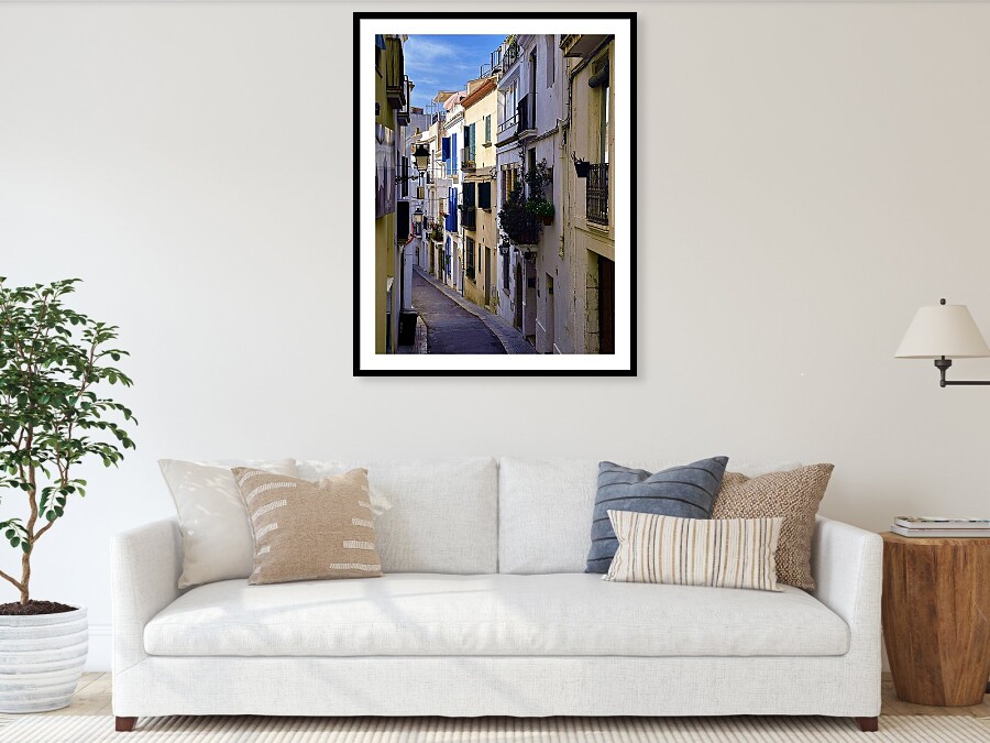 Long White-Walled Alley with Blue Shutters, Sitges Old Town Framed Print